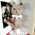 Bunny with Flower Basket on a Vintage cotton Reel Ornament