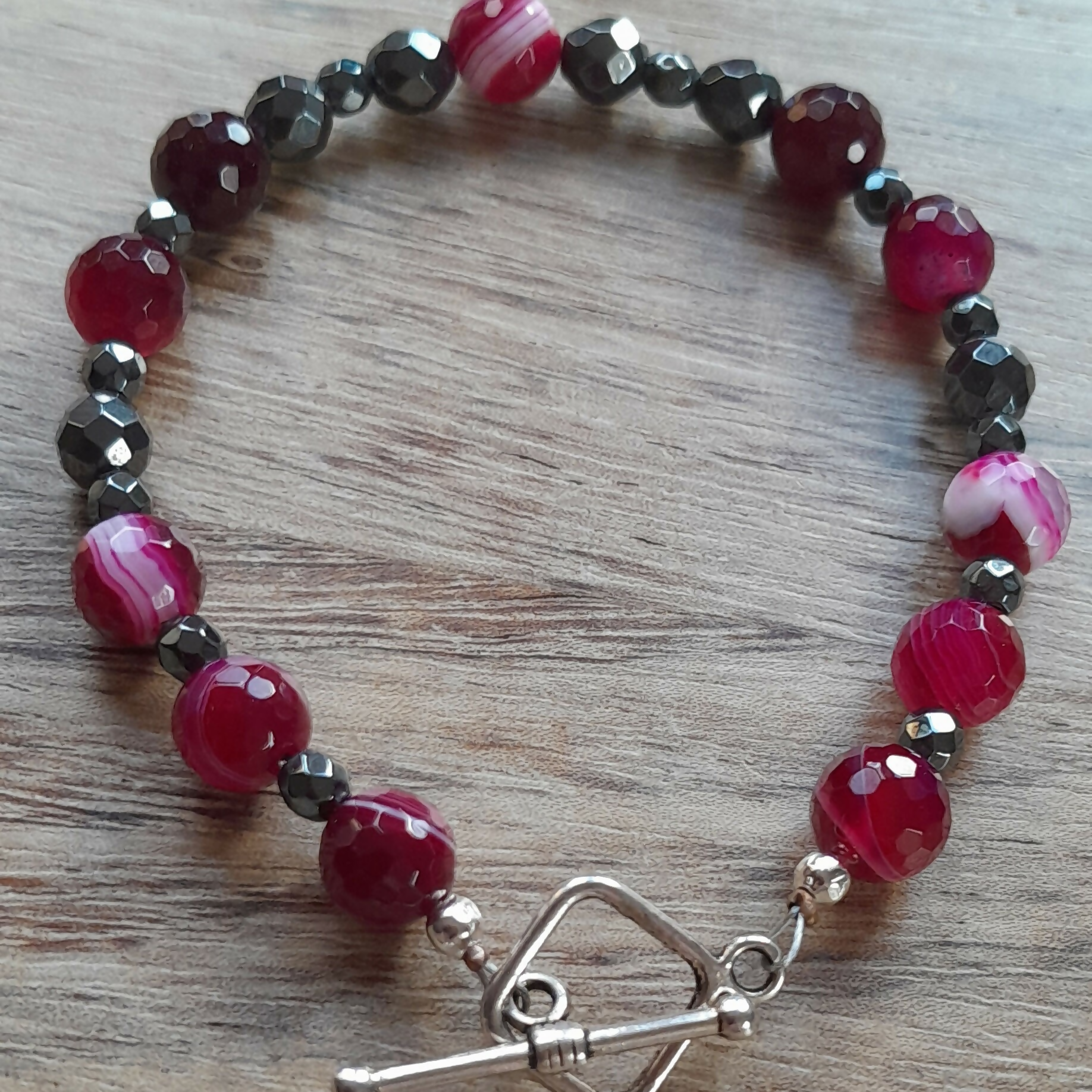 Tibetan Silver Toggle Clasp Bracelet with Faceted Fuchsia Banded Agate, Faceted Grey Hematite