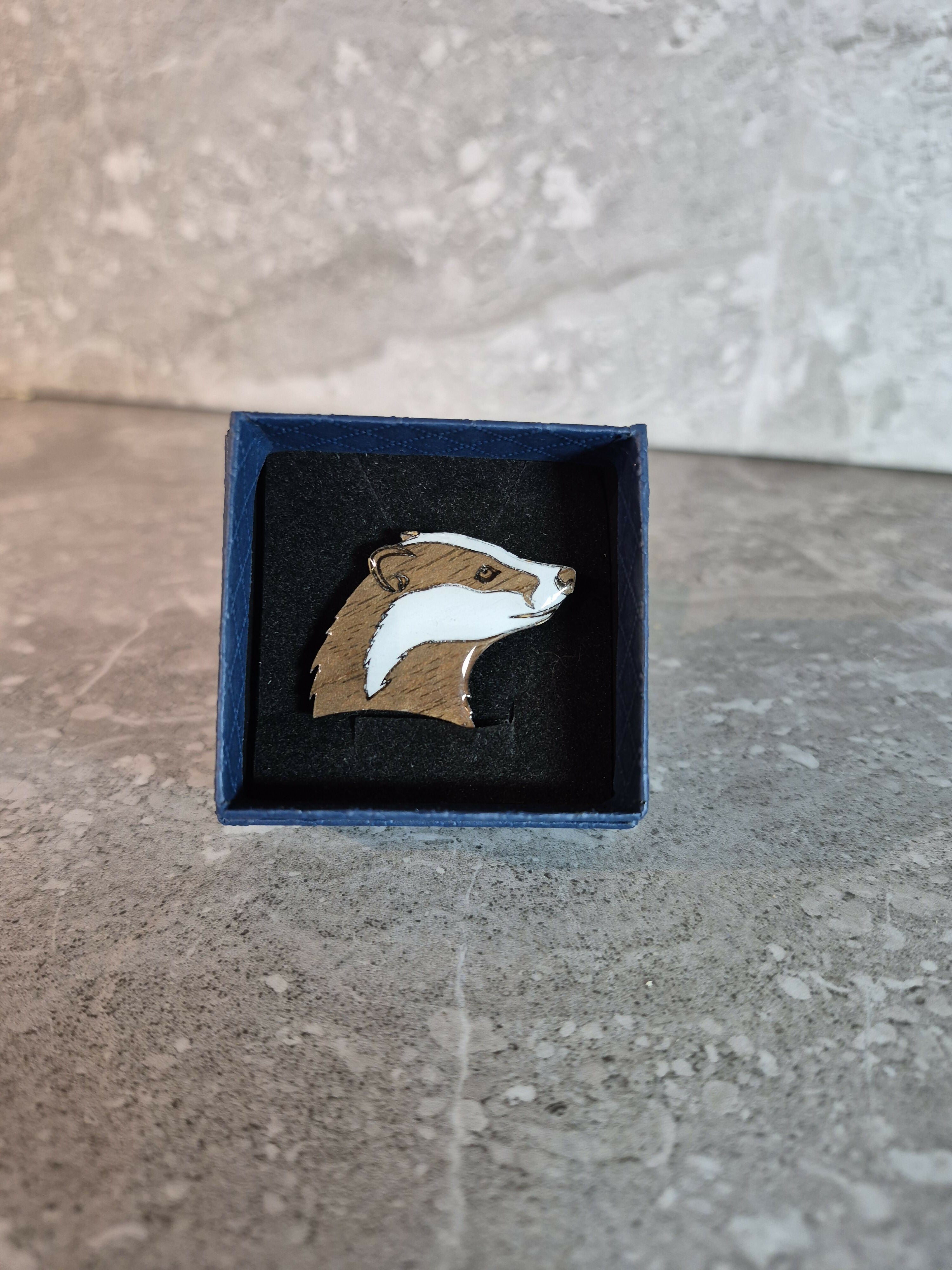 Handcrafted Walnut veneered badger head pin.