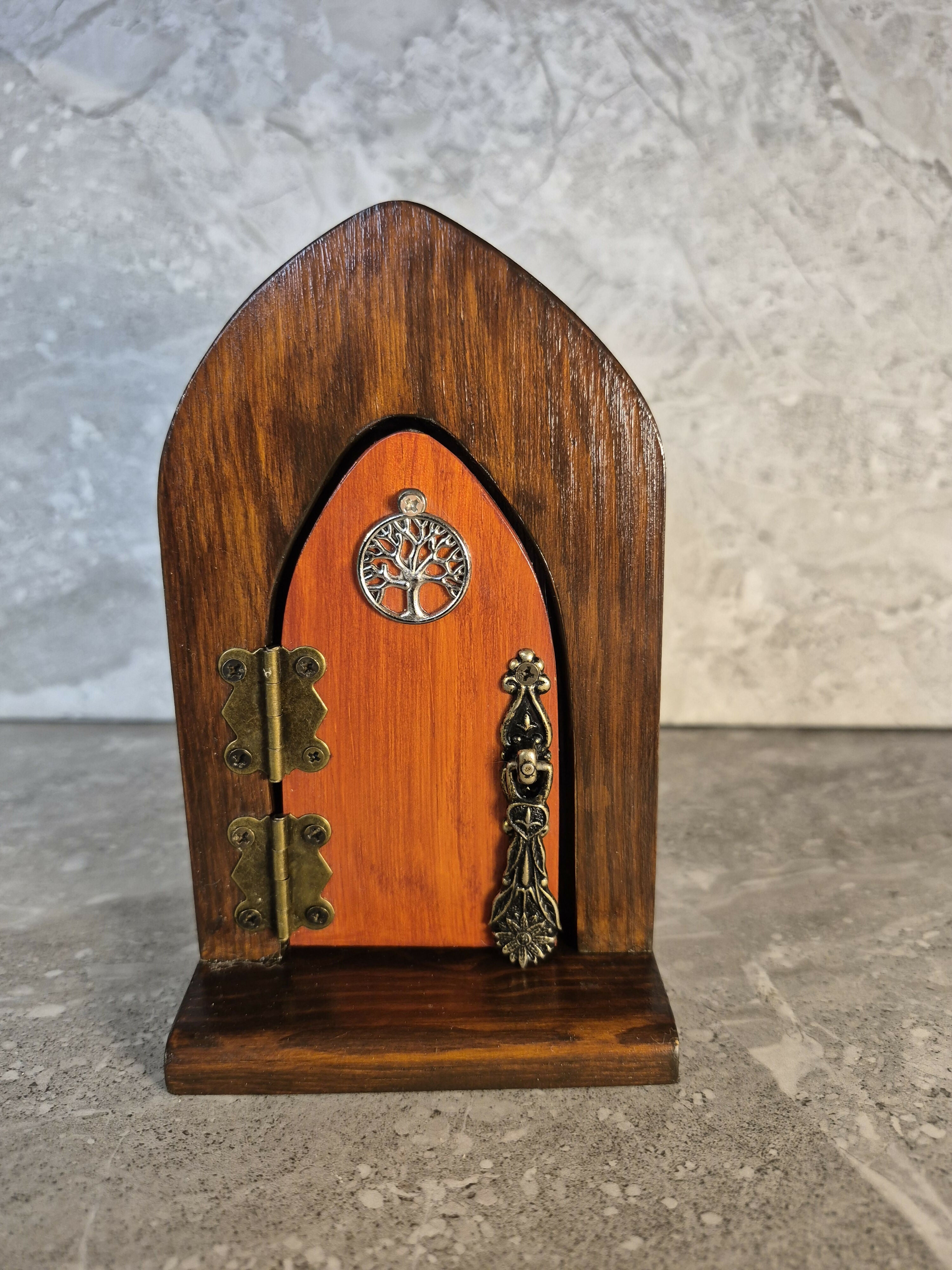 Handcrafted arched wooden fairy door.