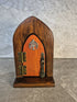 Handcrafted arched wooden fairy door.