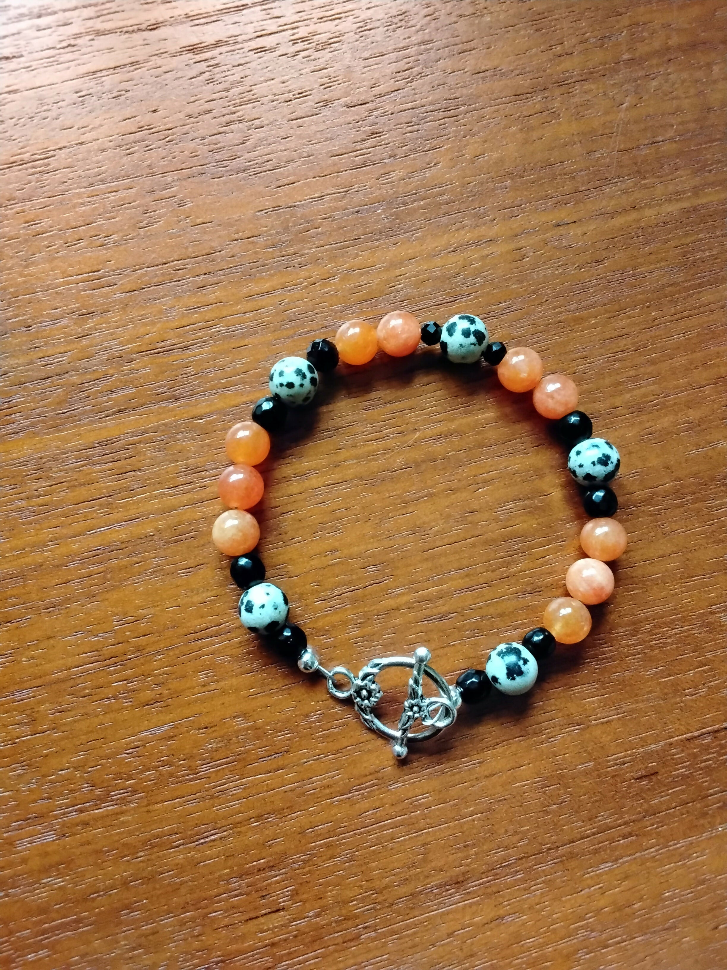 Tibetan Silver Toggle Catch Bracelet with Faceted Onyx, Dalmatian Jasper & Orange Chalcedony.