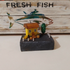 Small Yellow House with Plants, on Driftwood