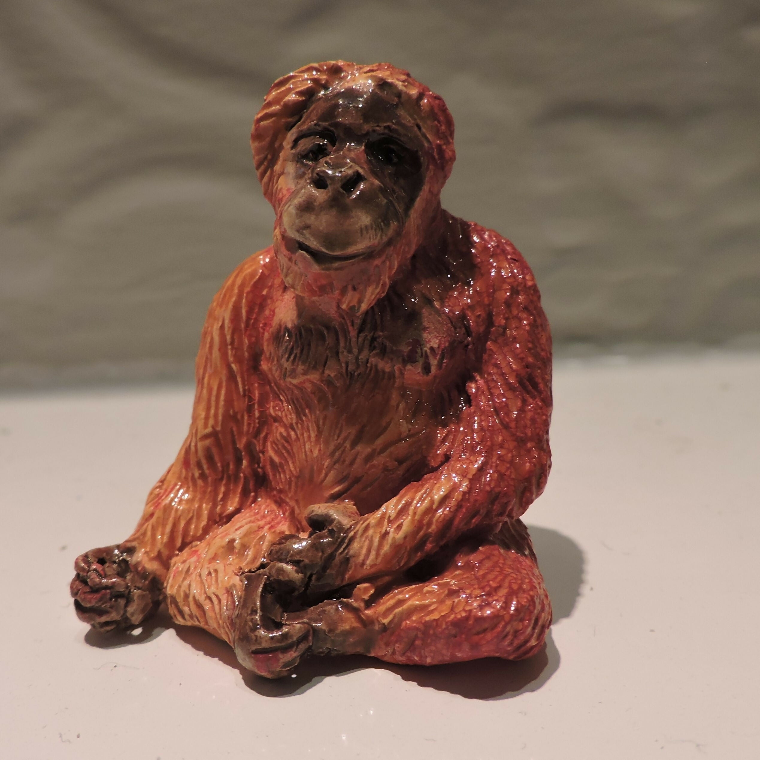 Ceramic orangutan sculpture