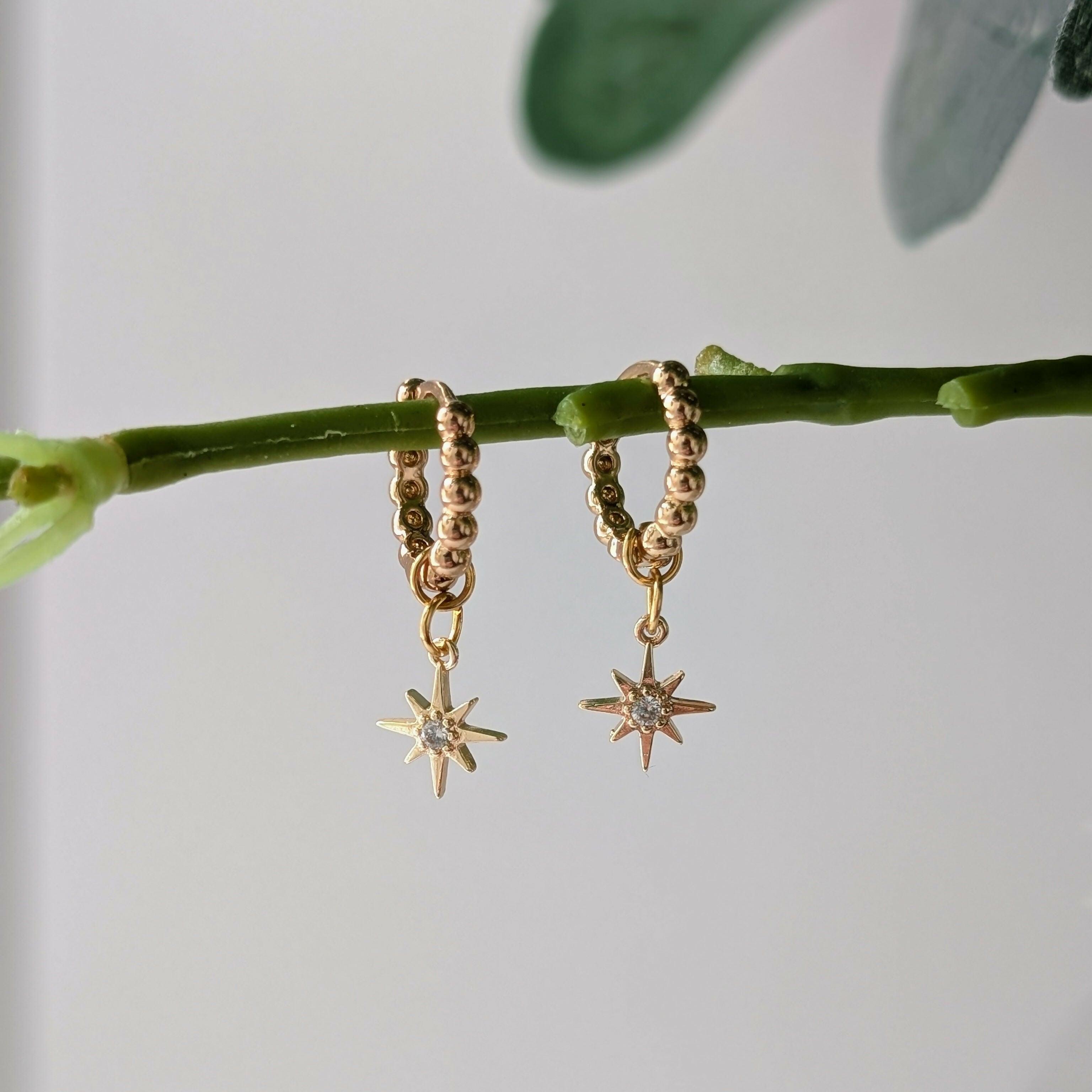 Gold Plated Bead Huggie Earrings with a Tiny Gold Cubic Zirconia Star Charm