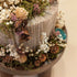 Warm Floral Arrangement on Mini Wooden Plant Stand