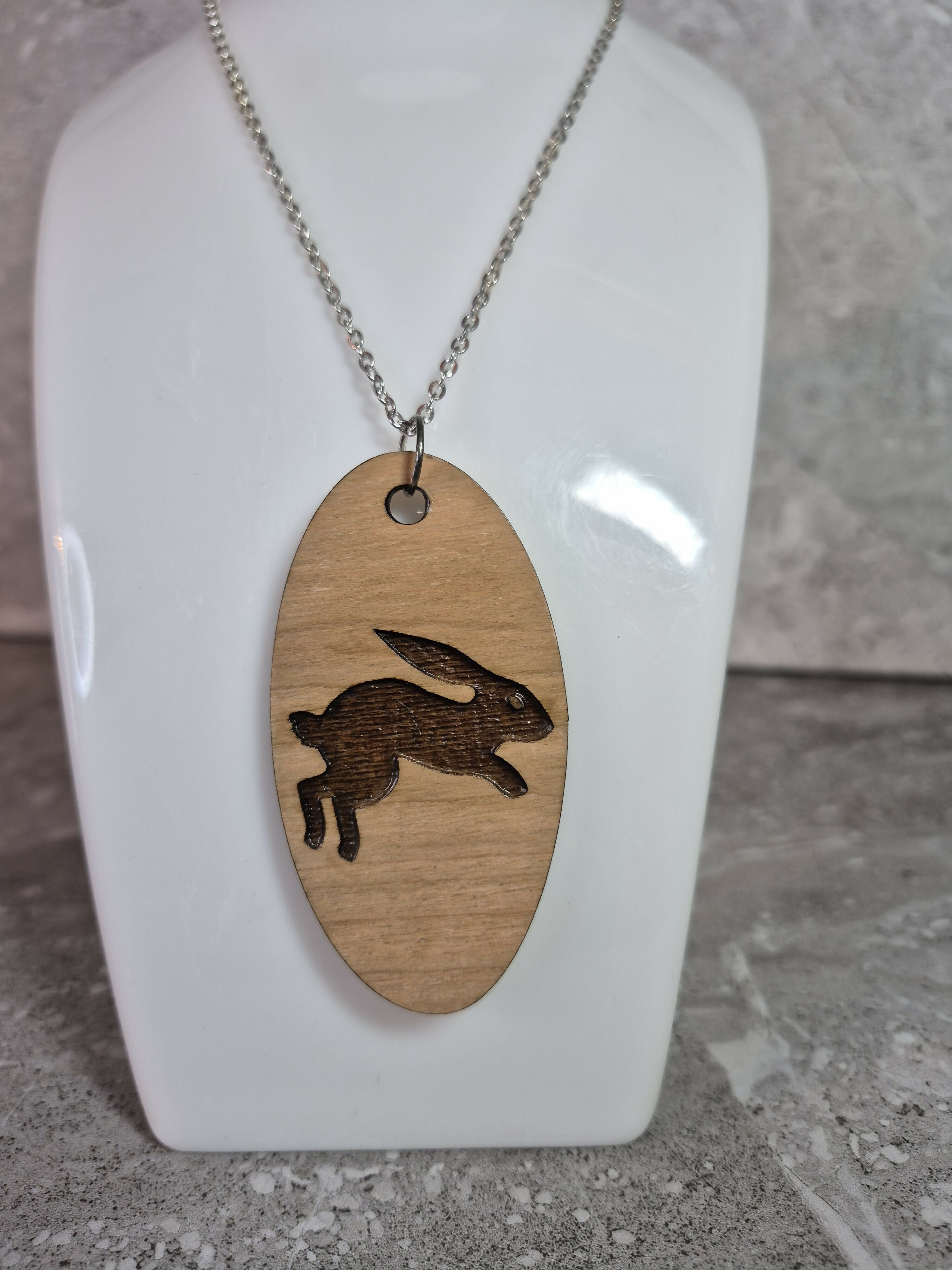 Unique Handcrafted, Oval, Cherry Veneered, Pendant With An Engraved Leaping Hare