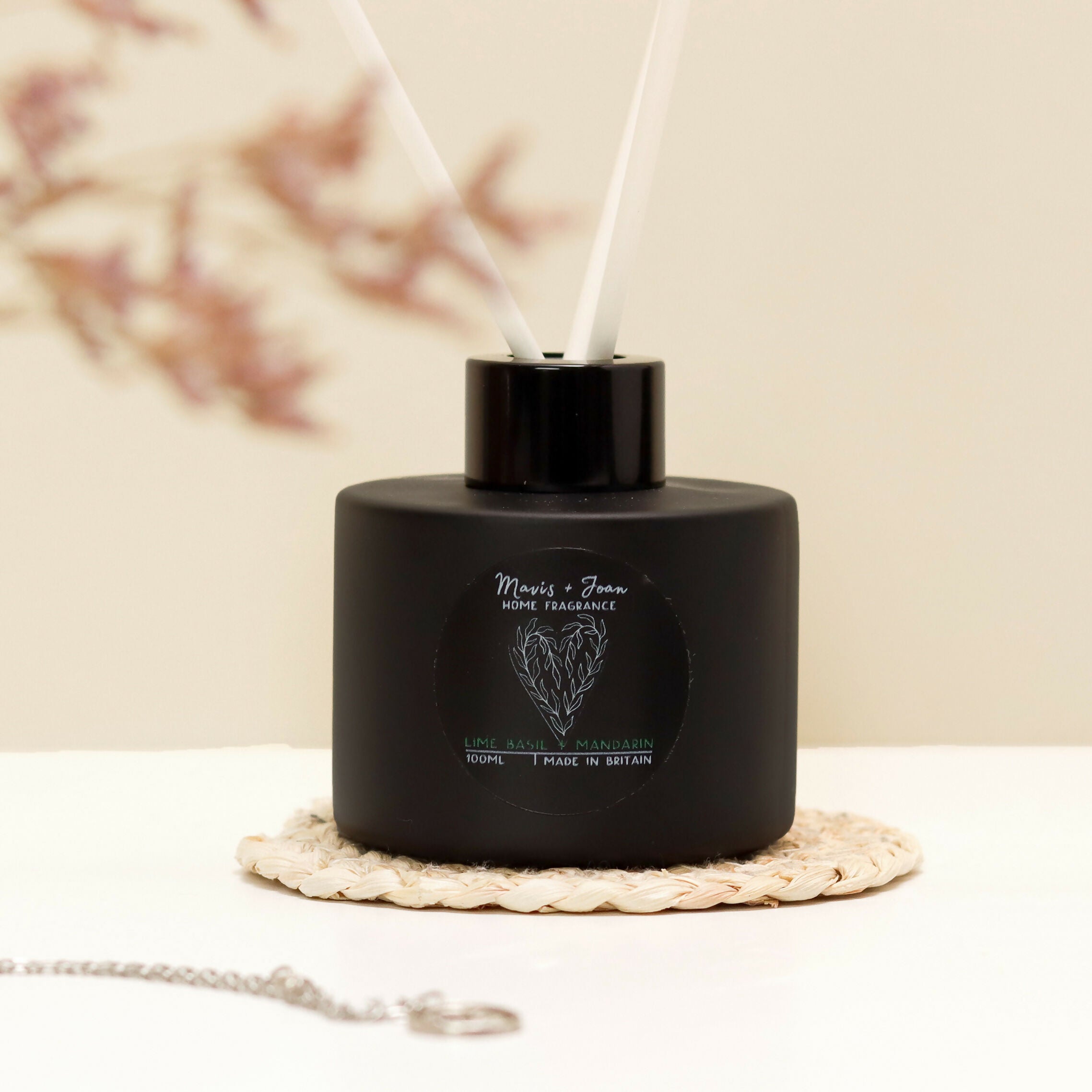 Reed Diffuser with black glass bottle and white reeds