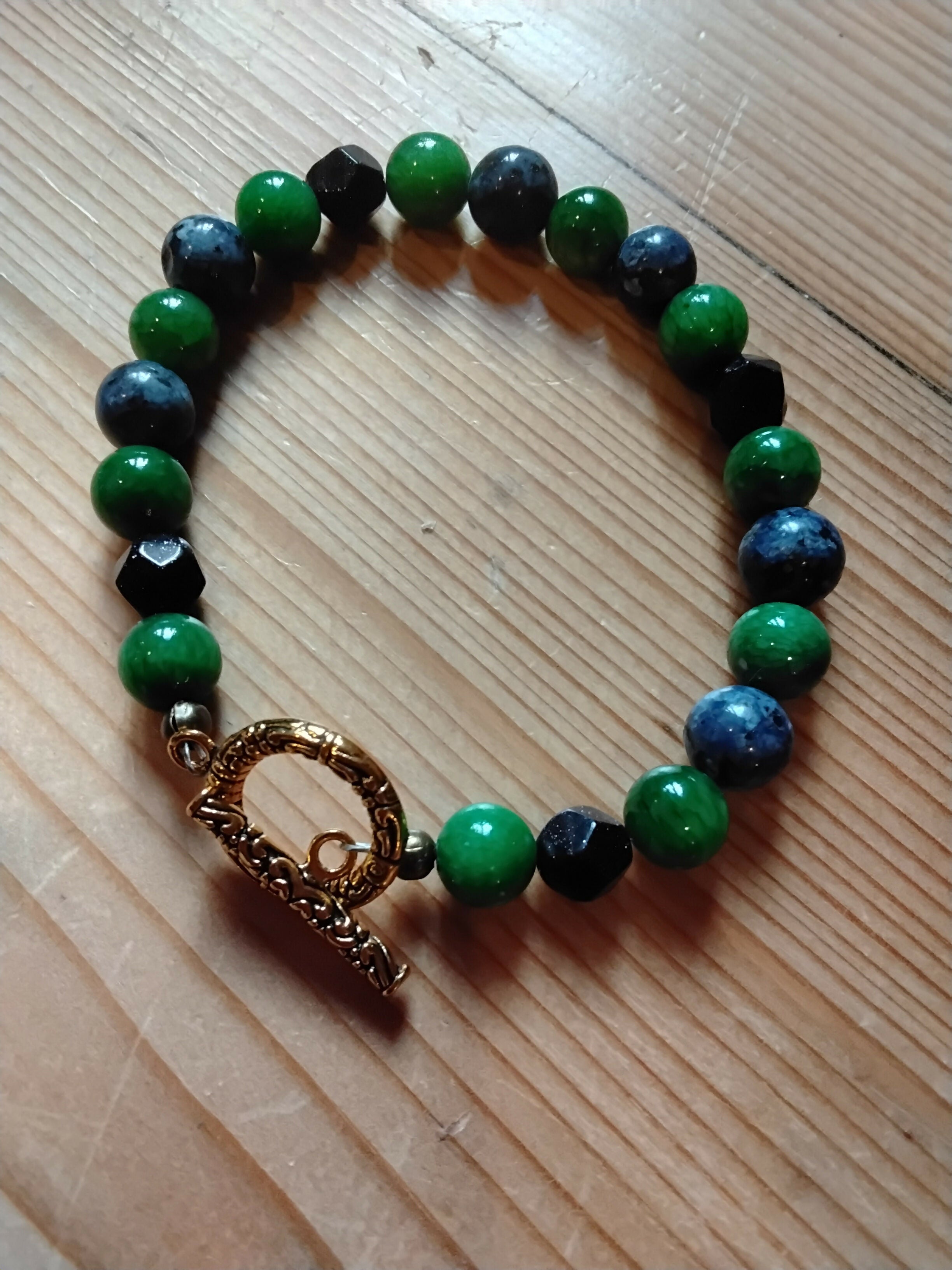 Gold effect Tibetan Silver toggle Catch Bracelet with Pea Green Chalcedony, Faceted Navy Goldstone and Blue Spotted Jasper.