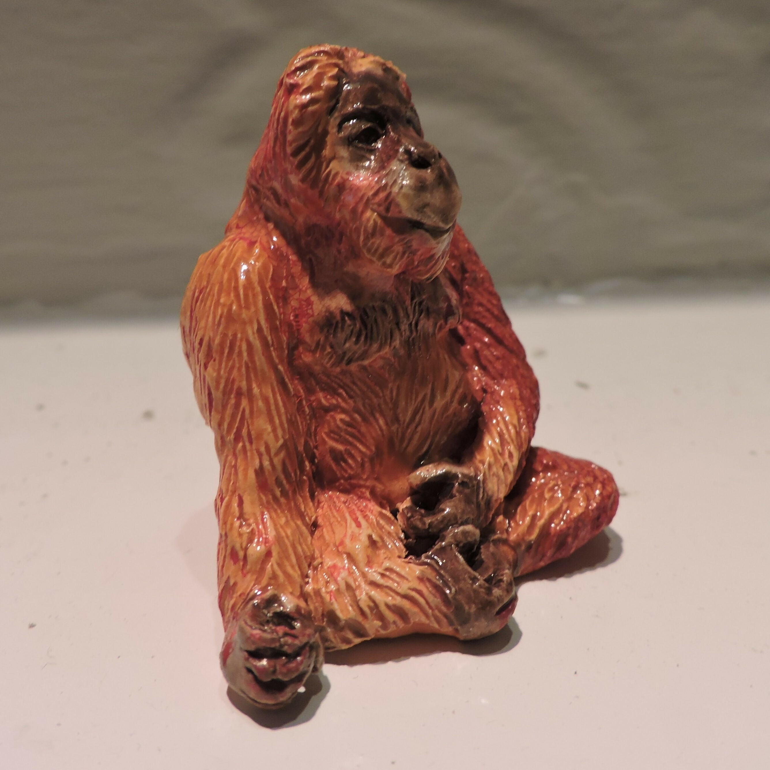 Ceramic orangutan sculpture