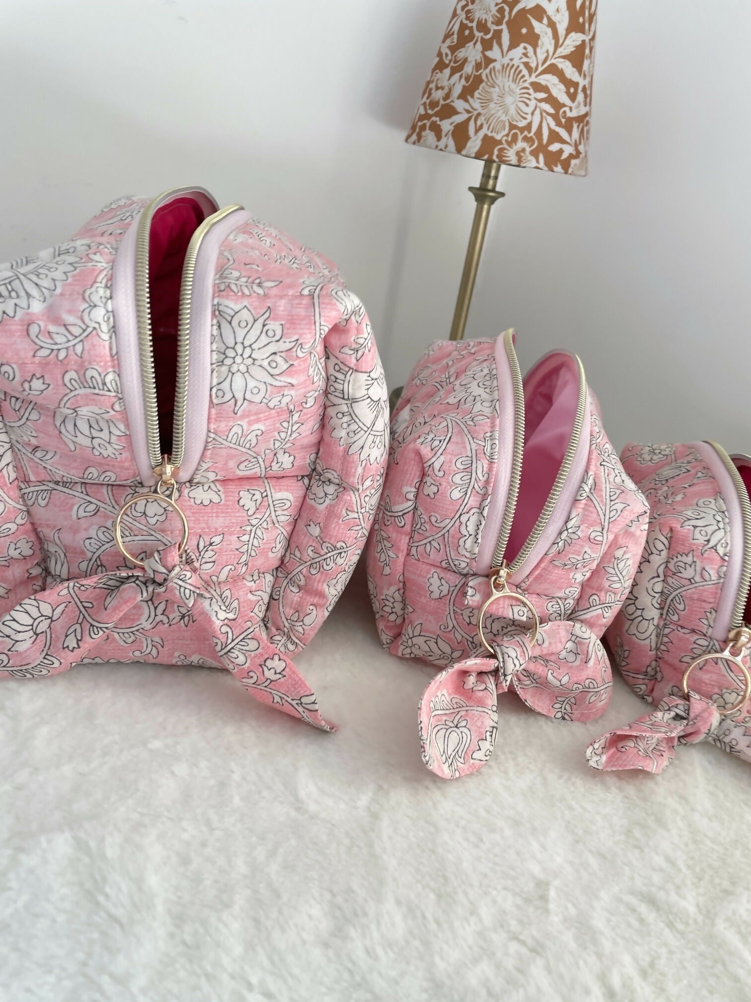 Pink Quilted Toiletry Bag with Zipper with white flower print