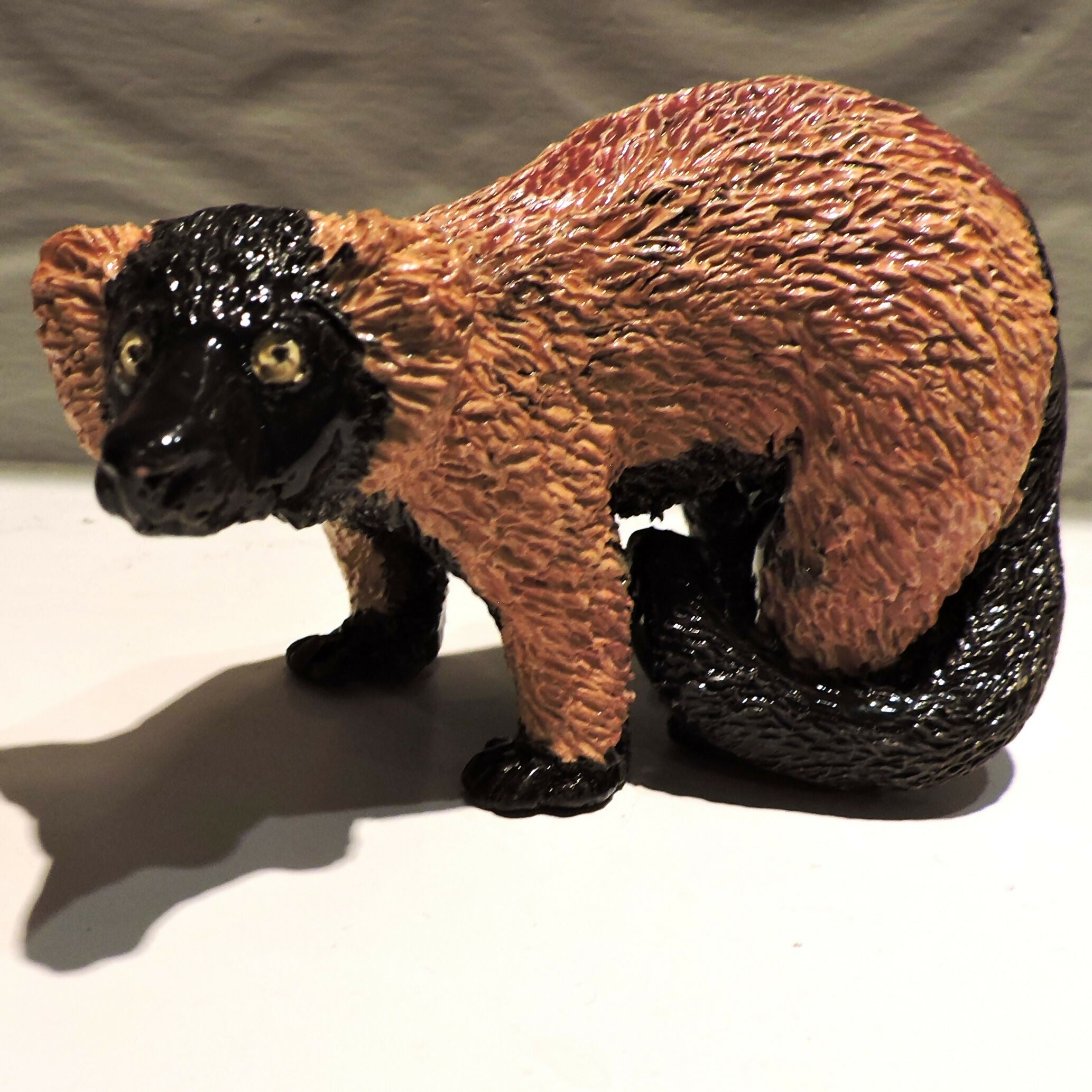 Ceramic standing Red ruffed lemur sculpture