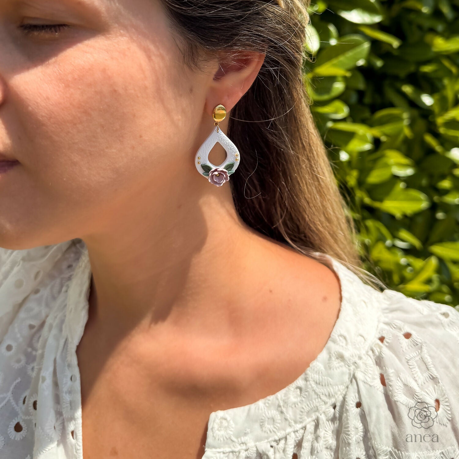 Floral Drop Earrings with Embossed Texture and Gold Detail in Pastel Pink