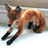 Ceramic pouncing fox sculpture