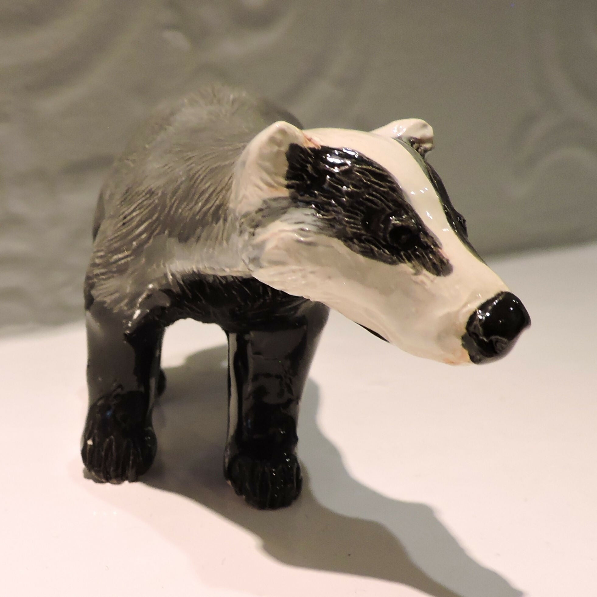 Ceramic Badger sculpture, prowling