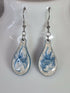 Handcrafted teardrop ivory and cyan colour earrings.