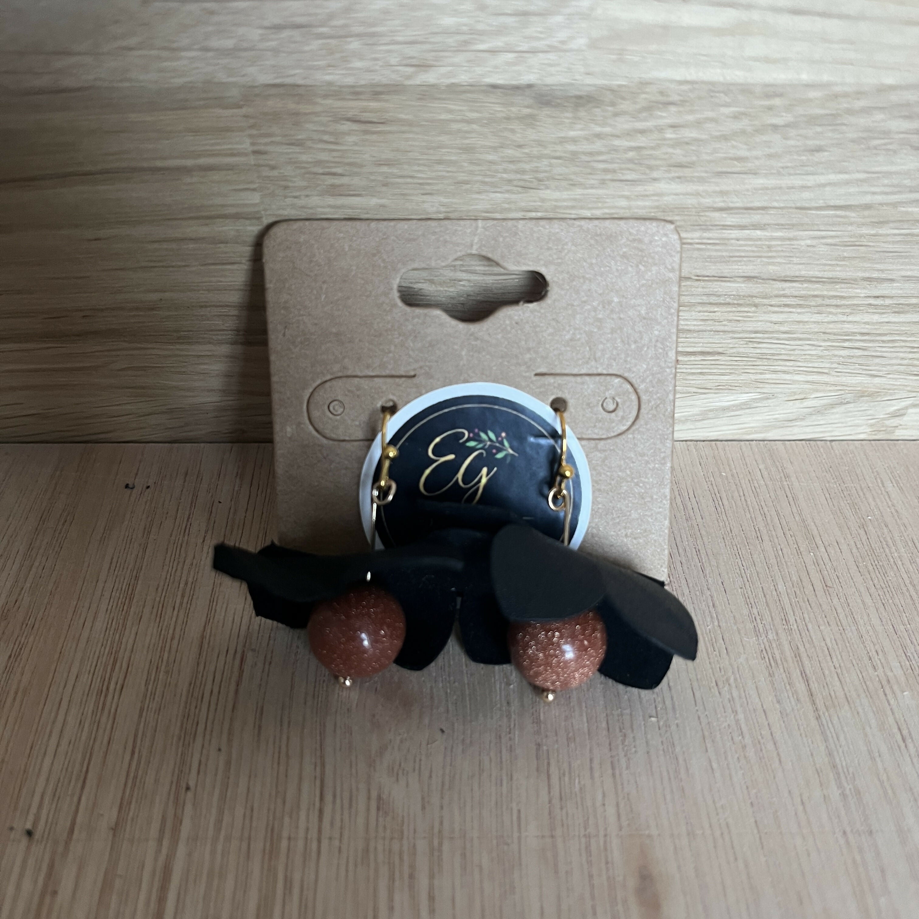 Forest Whisper – Black Leather Flower Earrings with Brown Stone