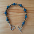 Tibetan Silver toggle Bracelet with Faceted Grey Hematite, Blue Spot Jasper and Bronze Hematite.
