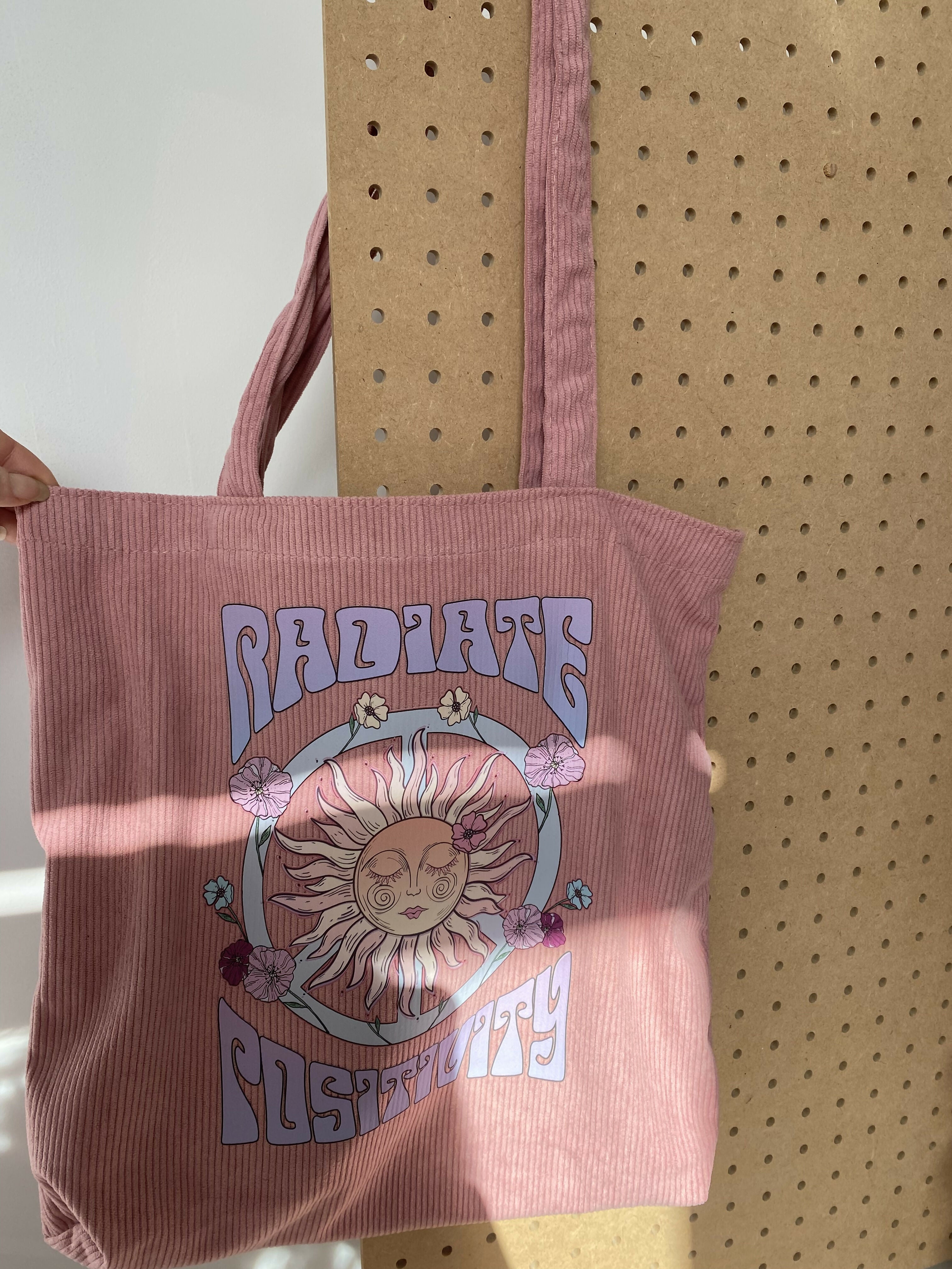 Radiate positivity pink tote bag