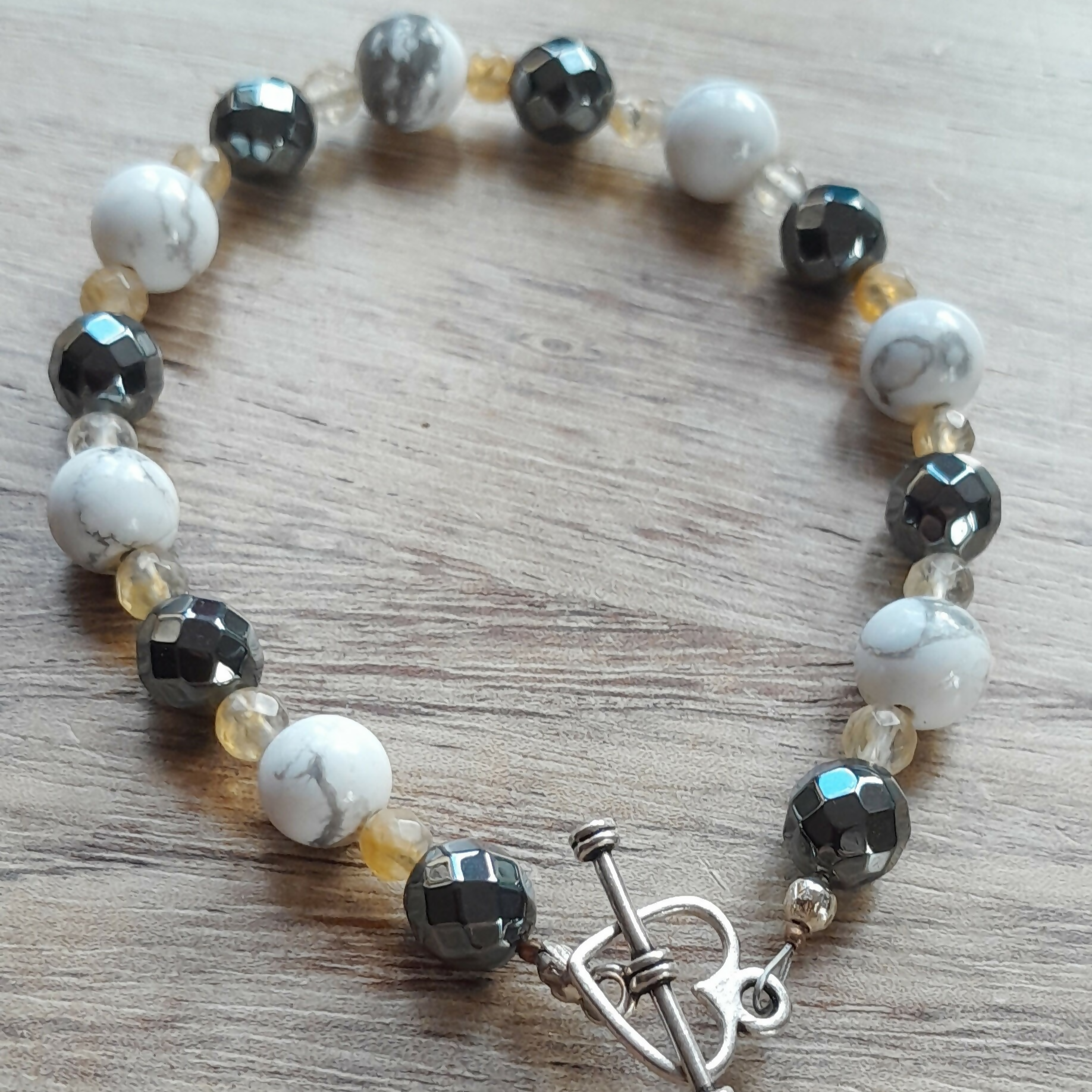 Tibetan Silver Toggle Clasp Bracelet with Faceted Grey Hematite, Faceted Citrine and Howlite.
