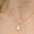 White Jade Faceted Teardop Charm Necklace on a Gold Plated Chain