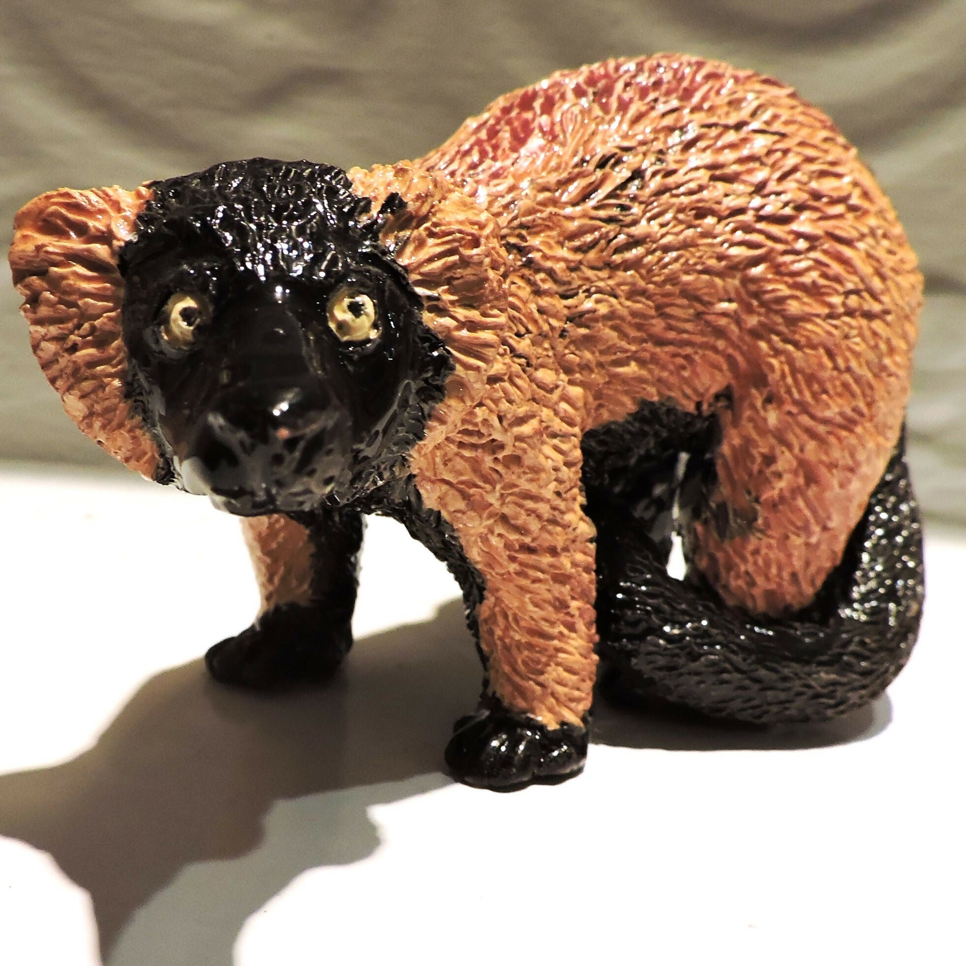 Ceramic standing Red ruffed lemur sculpture
