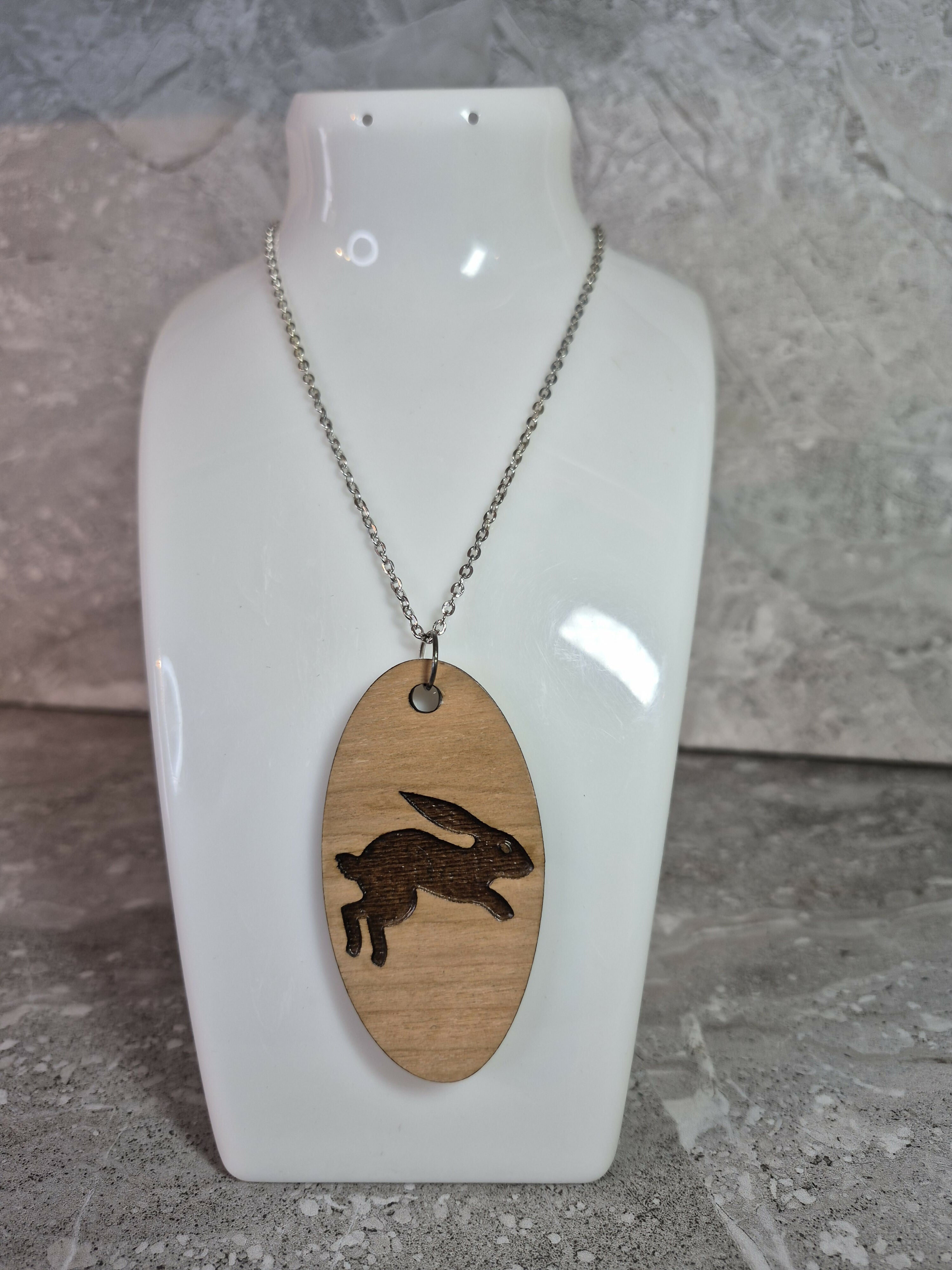 Unique Handcrafted, Oval, Cherry Veneered, Pendant With An Engraved Leaping Hare