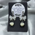 Square Tooth and White Bow Earrings