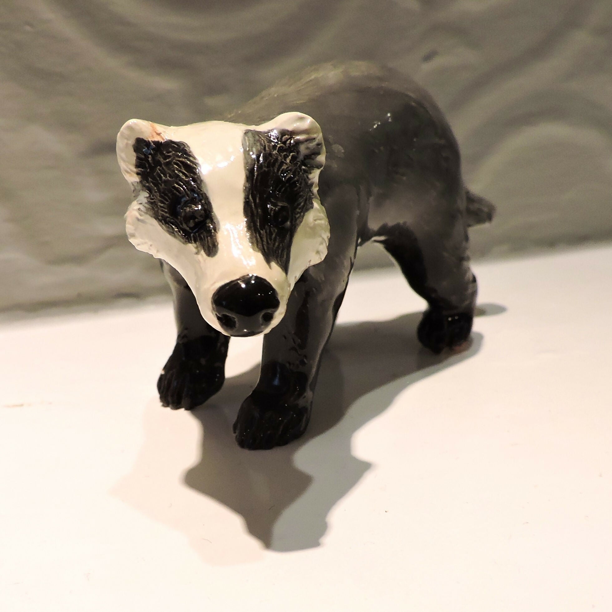 Ceramic Badger sculpture, prowling