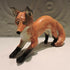 Ceramic pouncing fox sculpture