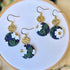 White Flower On Navy Circle Dangle Earrings