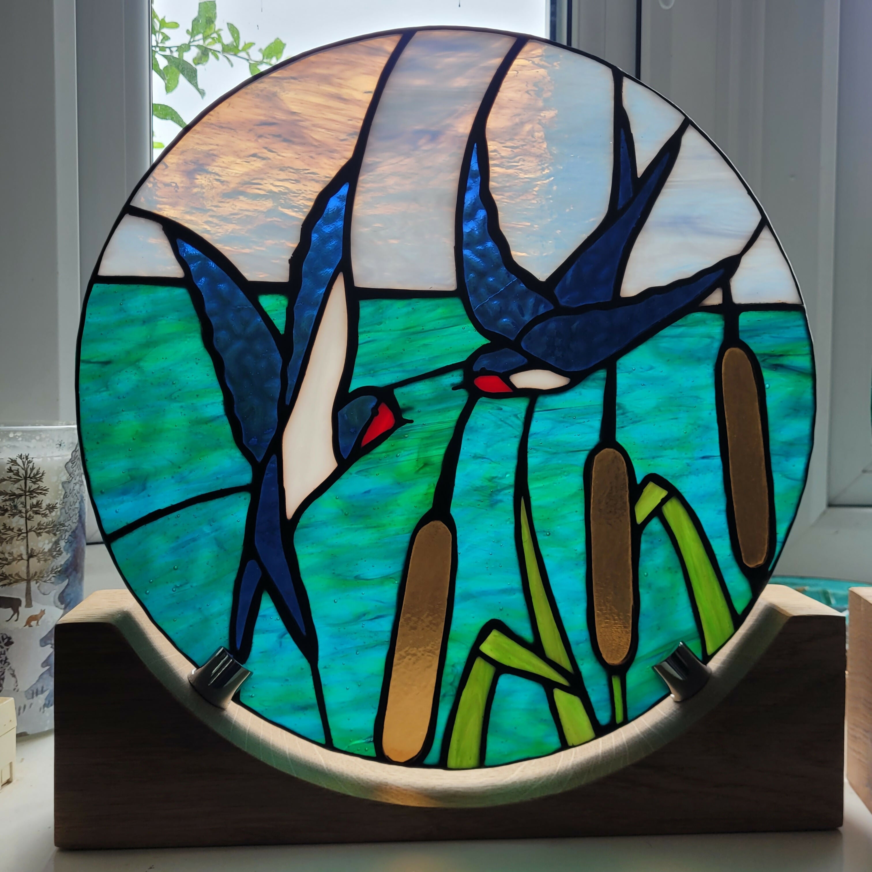 Glass Swallow Panel on oak wood display