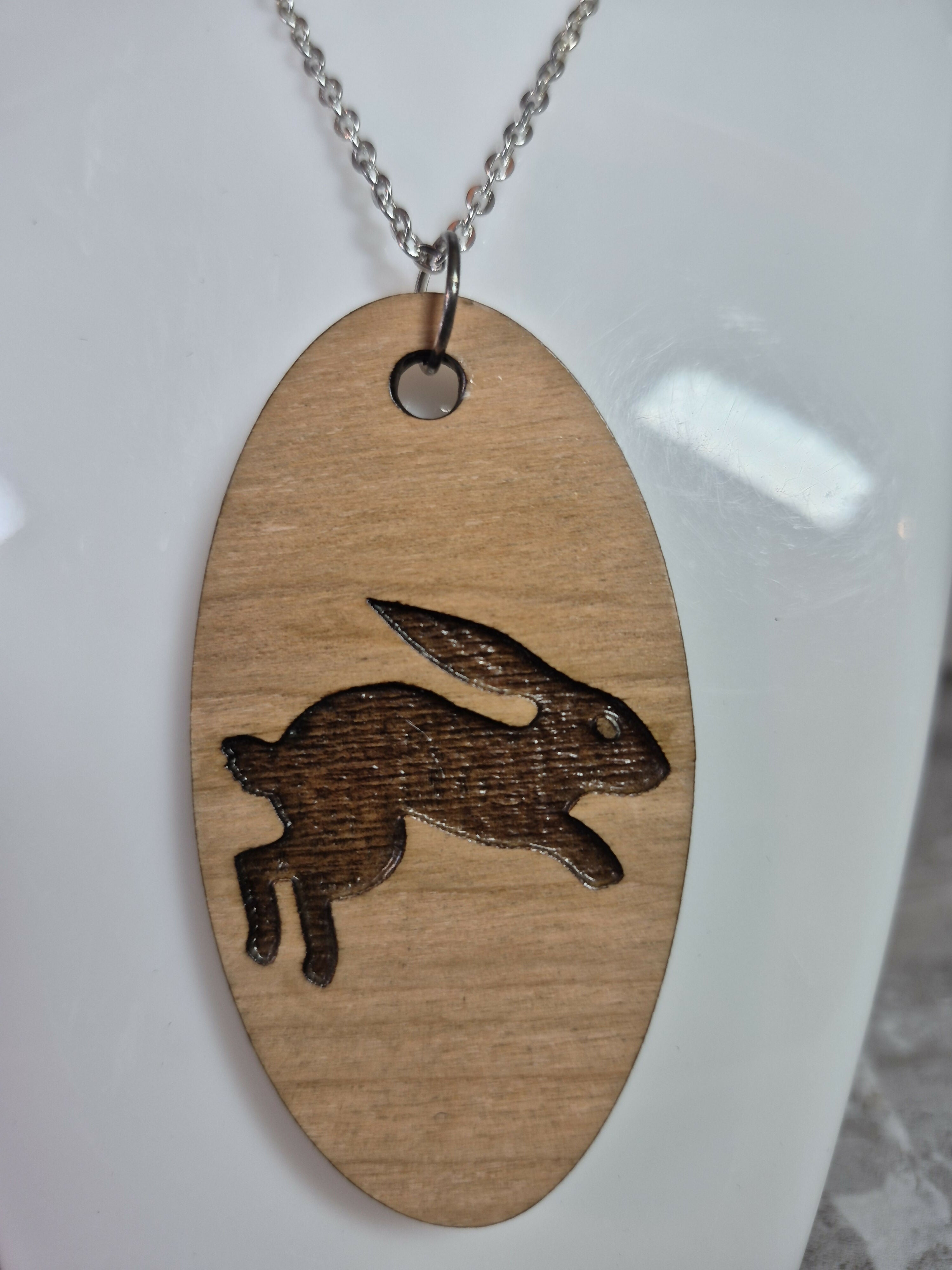 Unique Handcrafted, Oval, Cherry Veneered, Pendant With An Engraved Leaping Hare