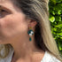 Green Floral Drop Earrings with White Blossoms and Gold Detail
