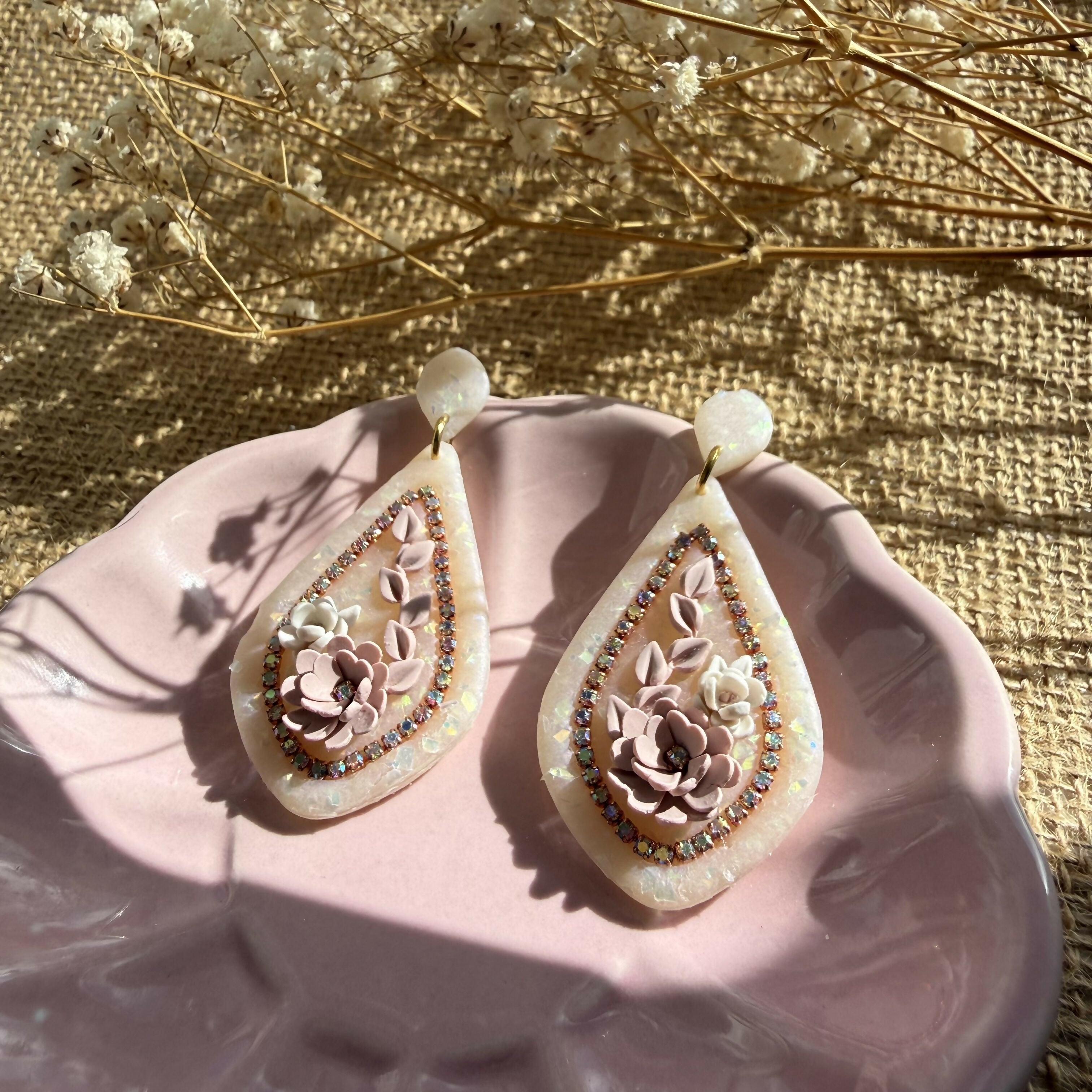 Floral Teardrop Drop Earrings with Rhinestone Border and Opal Glitter Detail in Nude
