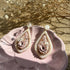 Floral Teardrop Drop Earrings with Rhinestone Border and Opal Glitter Detail in Nude