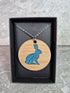 Unique Handcrafted Round Pendant Showing a Seated Hare
