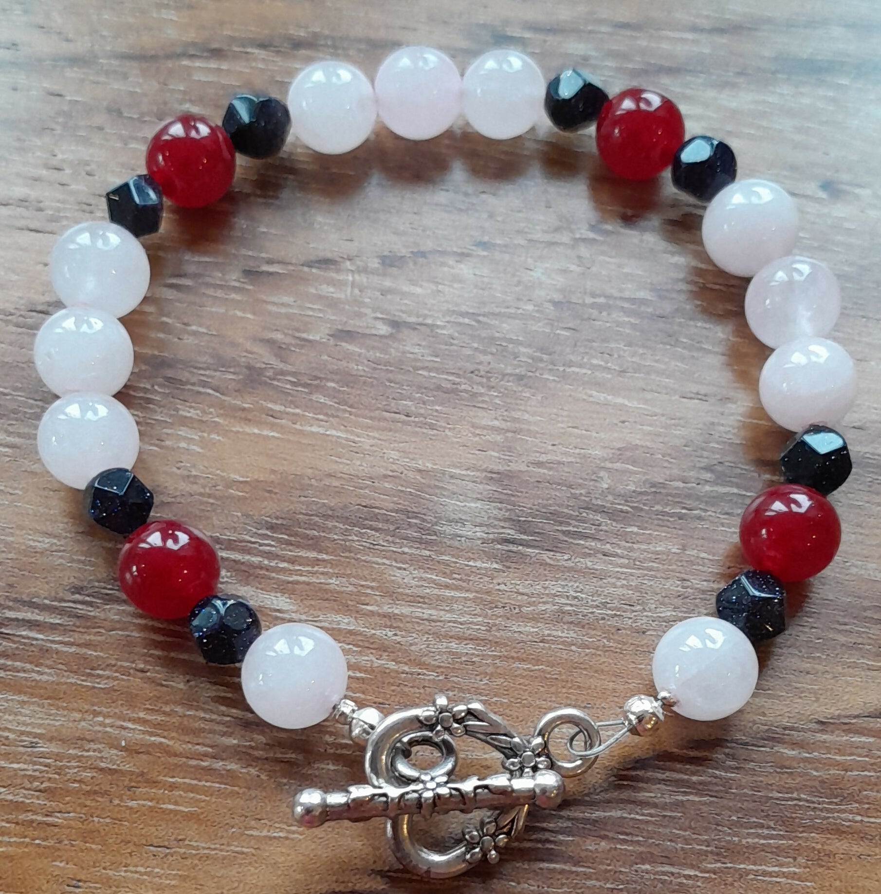 Gemstone Braelet with Tibetan Silver Toggle Catch, Rose Quartz, Faceted Navy Goldstone and Red Chalcedony.