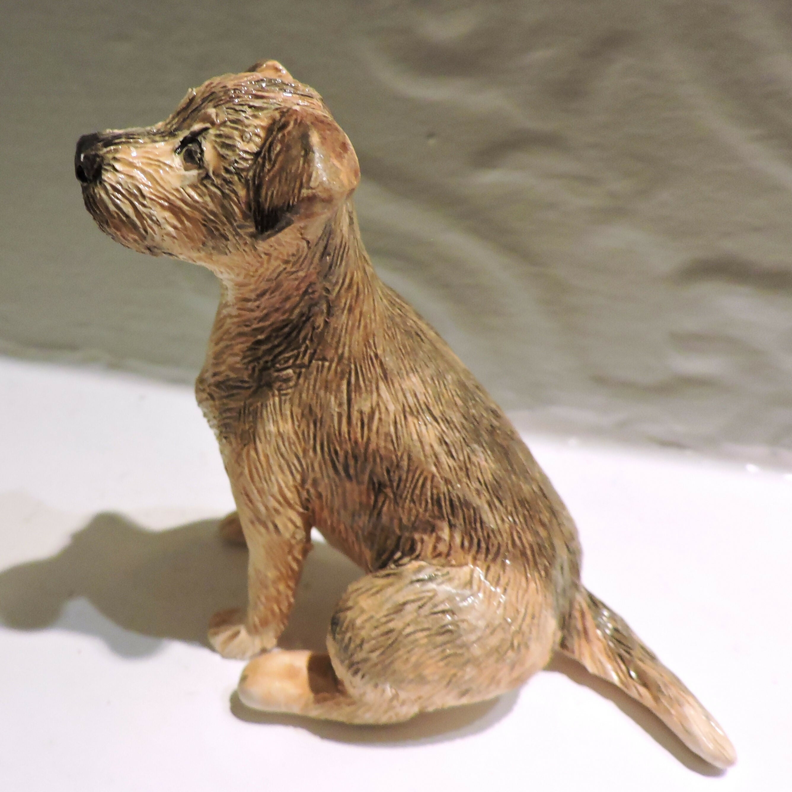 Ceramic border terrier dog sculpture