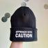 Approach With Caution Cuffed Rectangular Patch Beanie Hat