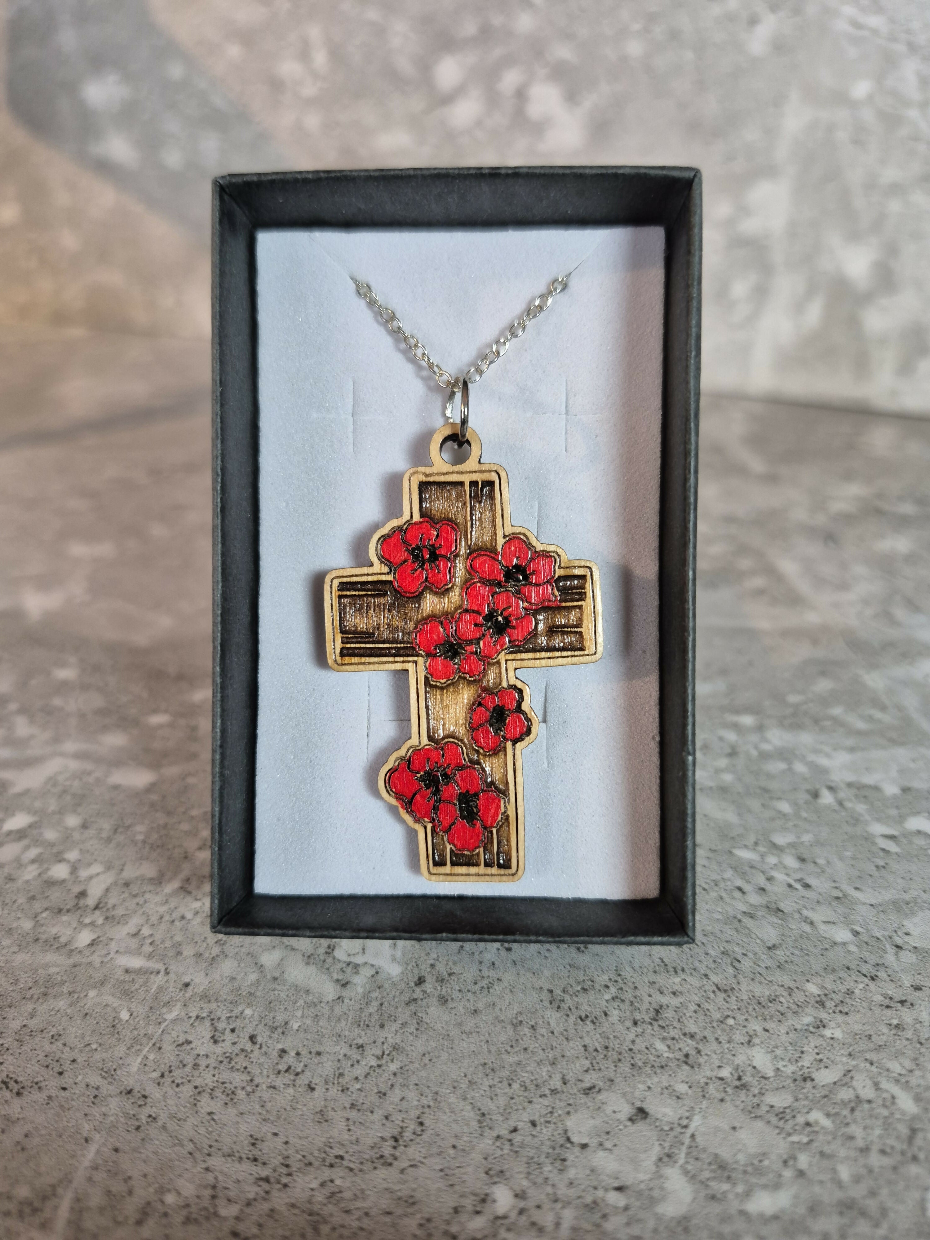 Handcrafted and engraved red poppy cross.