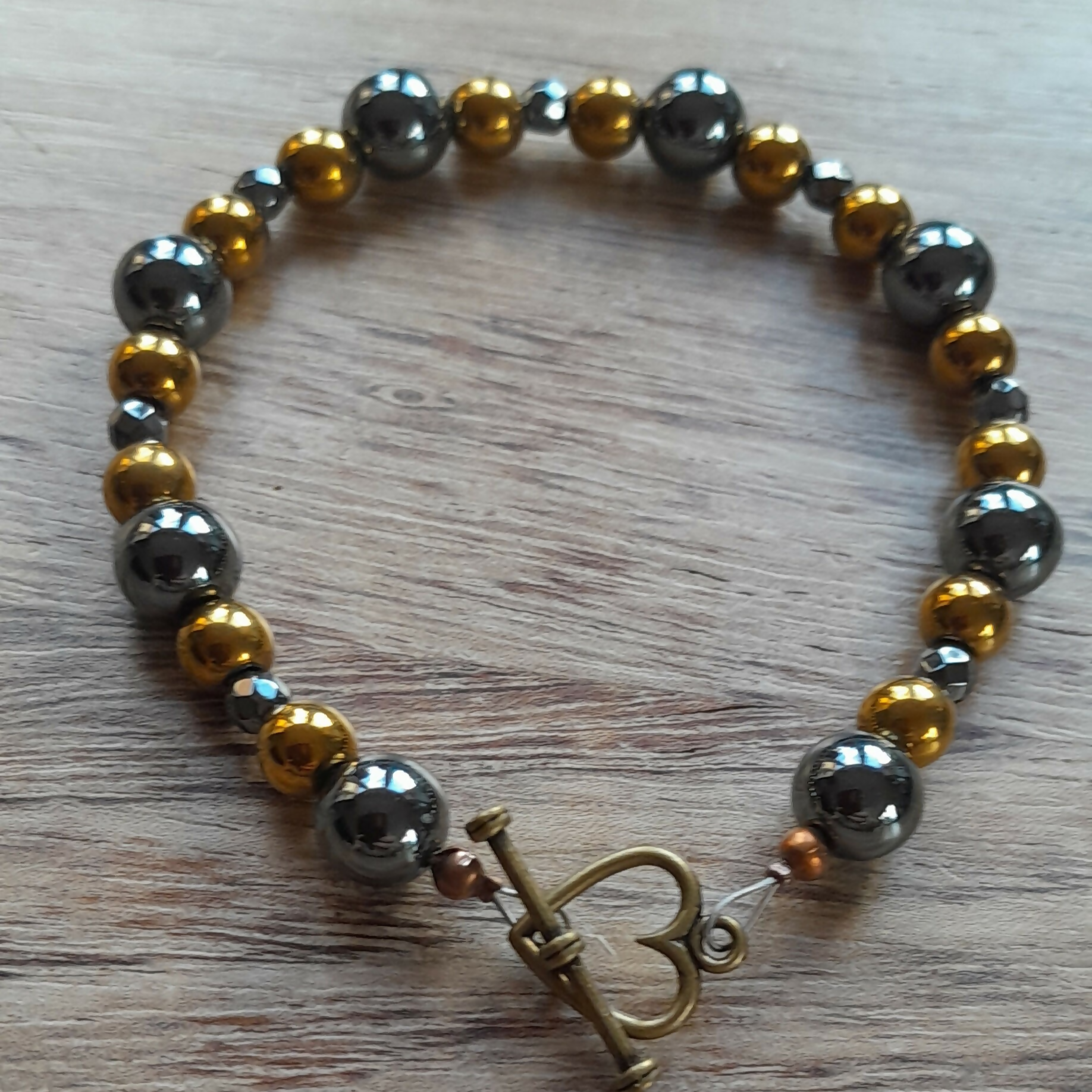 Bronze Toggle Clasp Bracelet with Round Grey Hematite, Bronze Hematite and Faceted Grey Hematite.