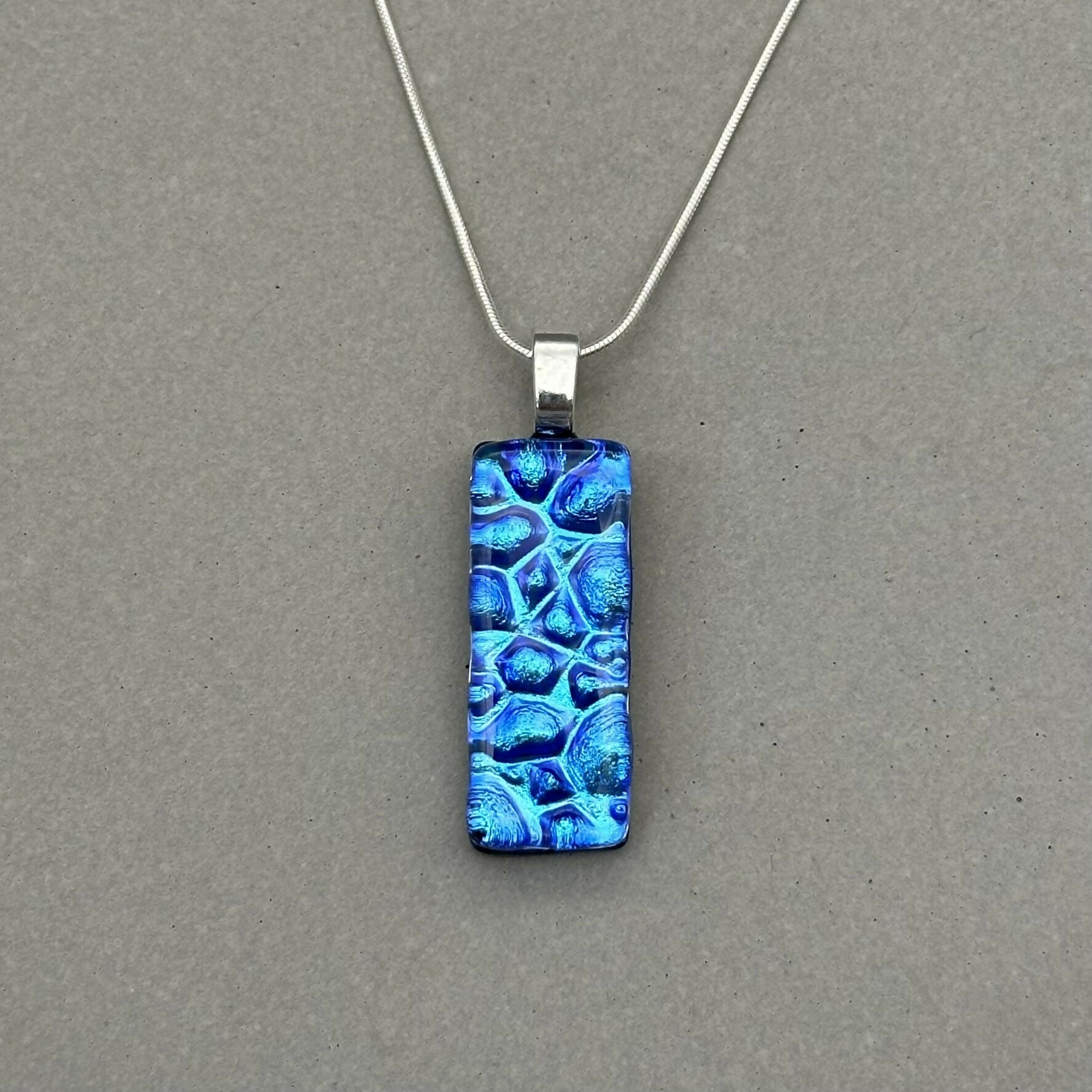 Blue Raindrop Dichroic Fused Glass Pendant with Silver Plated Chain - Handmade by Jade Tapson Glass.
