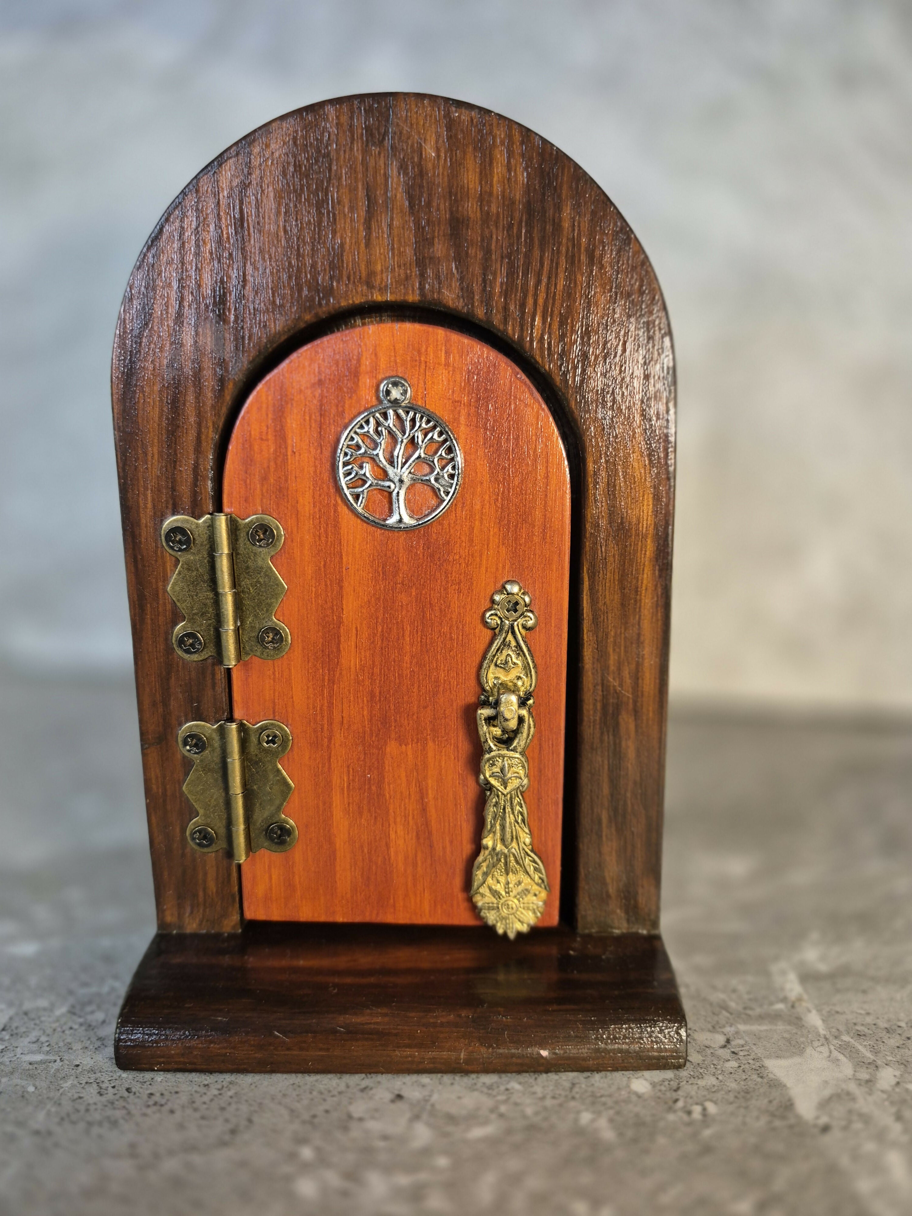 Handcrafted round arch wooden fairy door.