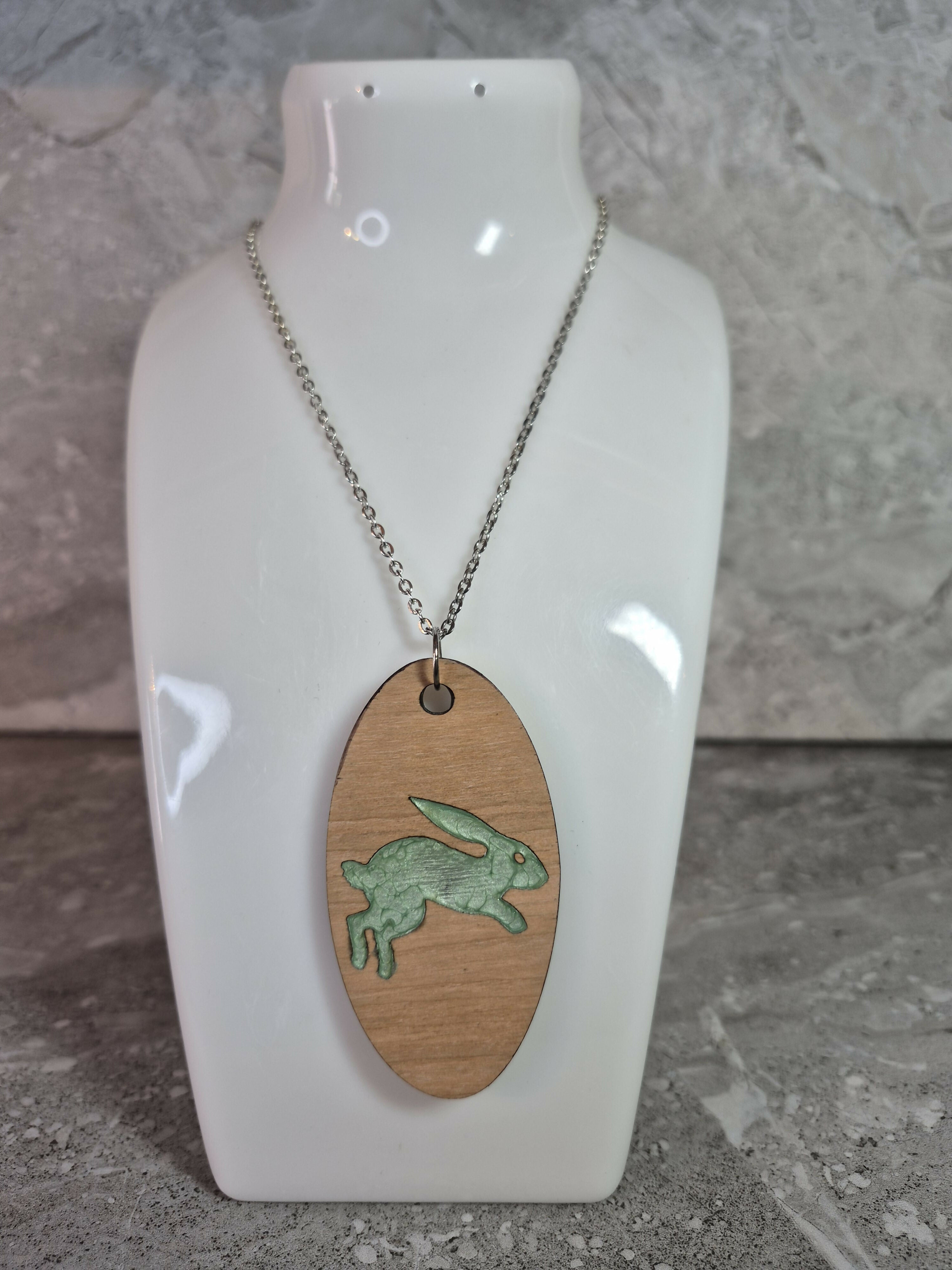 Unique Handcrafted Oval Cherry Wood Veneered Pendant With Engraved Leaping Hare