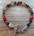 Gemstone Bracelet with a Tibetan Silver Catch, Banded Grey Agate, Navy goldstone, Red Jasper and Red Agate.