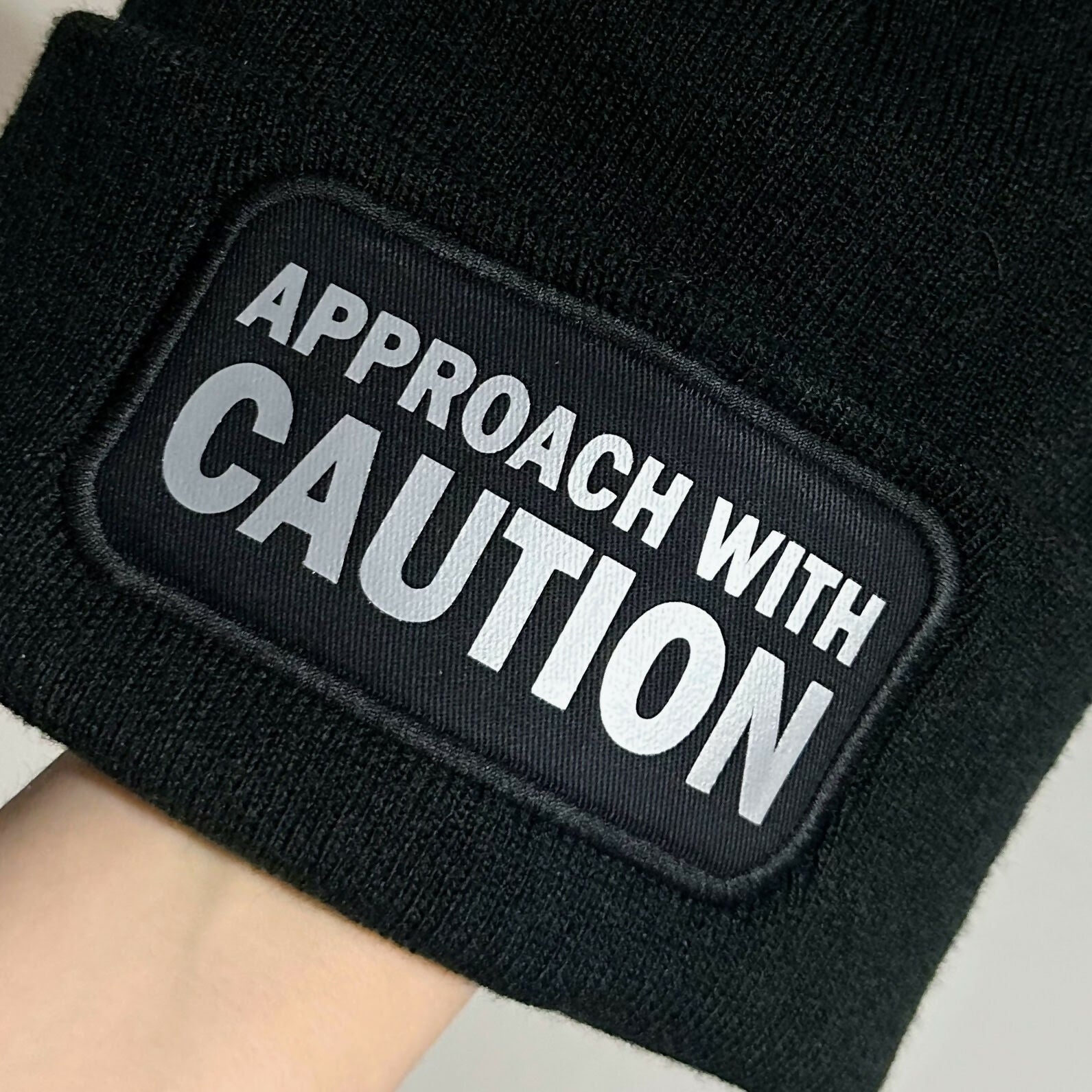 Approach With Caution Cuffed Rectangular Patch Beanie Hat
