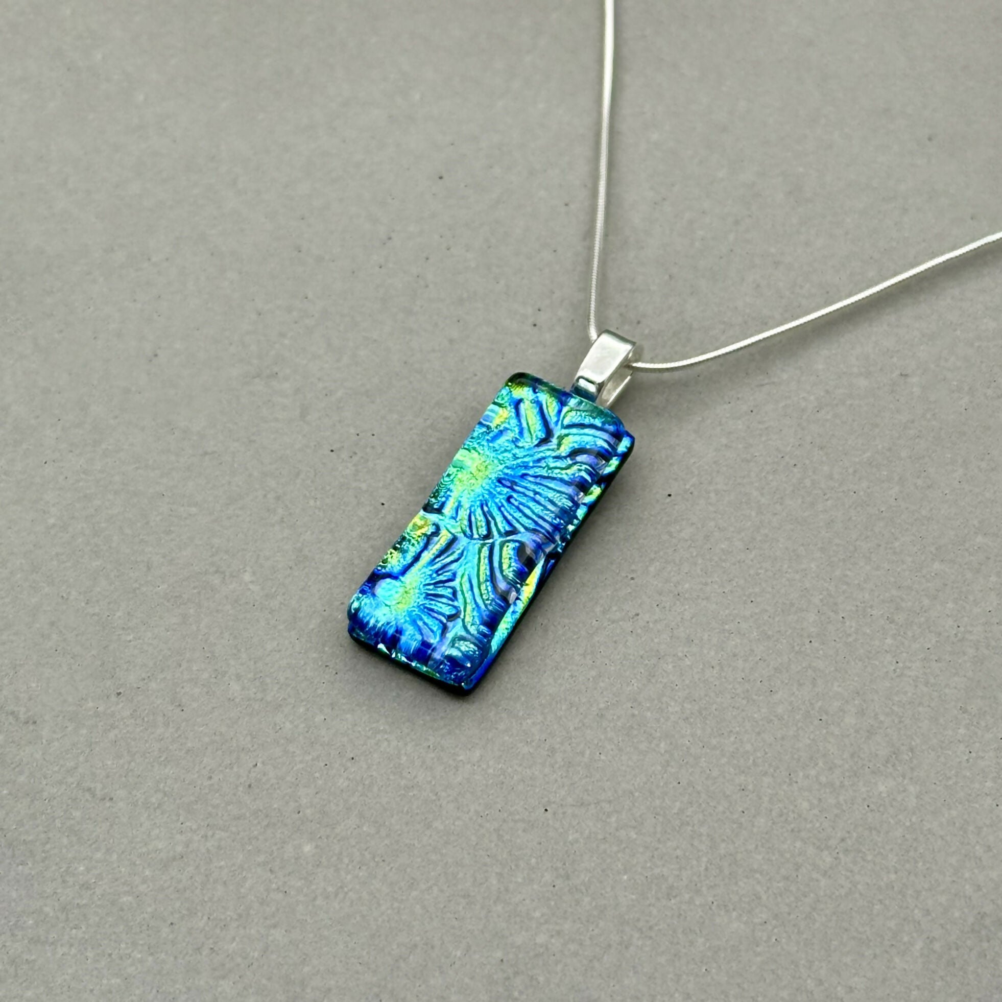 Blue & Green Flower Dichroic Fused Glass Pendant with Silver Plated Chain - Handmade by Jade Tapson Glass.