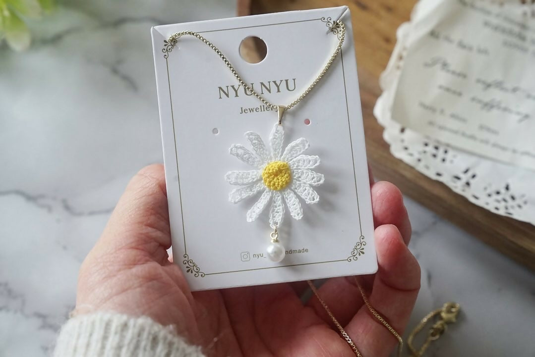 White Daisy Flower with Pearl Necklace