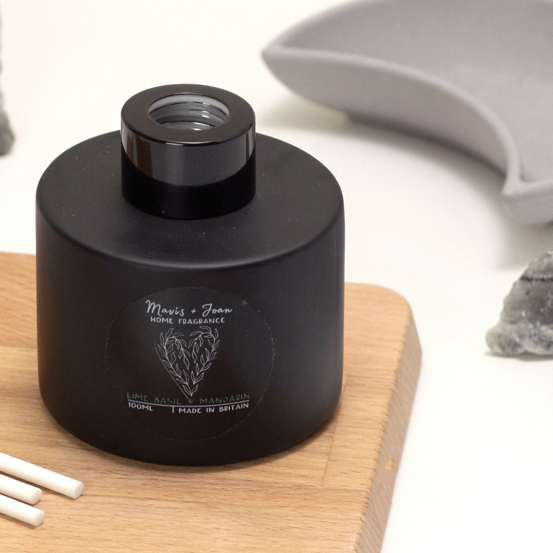 Reed Diffuser with black glass bottle and white reeds